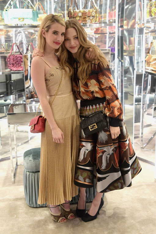 Emma Watson and Amanda Seyfried with their Fendi Baguettes for a Baguette party in New York, 2019