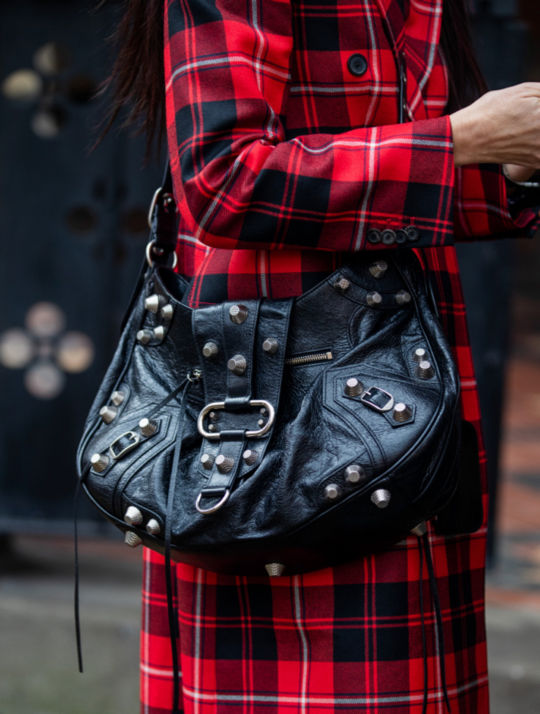 A guest wearing Louis Vuitton bag is seen outside Preen during