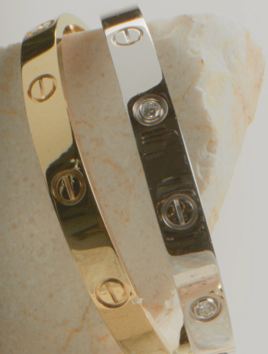 HERO Extreme close-up of a gold Cartier Juste un Clou bracelet with diamonds